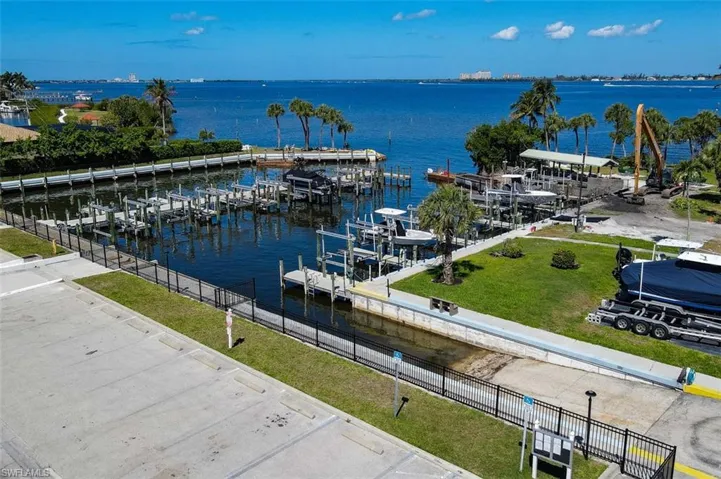 Aerial View of Marina. Shows Boat Ramp, Docks, Boat Slips with Lifts & Boat/Trailer Storage area. Current picture shows equipment in place for rebuild of Fishing Pier.