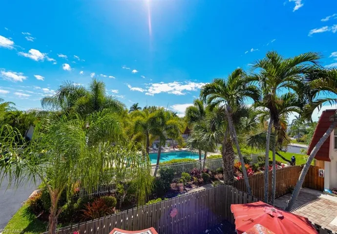 Private Balcony off the primary bedroom. Overlooks the private courtyard and views of the Pool that is just steps away from your townhome.
