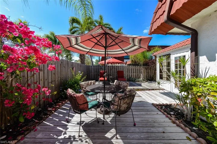 Large Private Courtyard with Patio Tables, Umbrellas and lounge chairs. Your Private Slice of Paradise in the Sun!