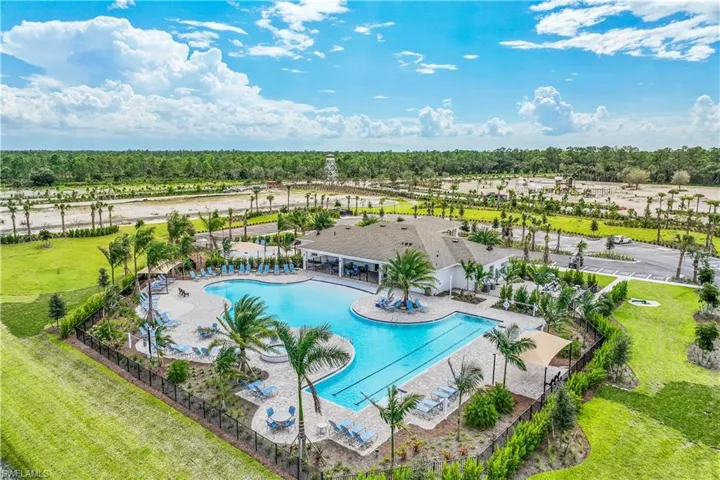 View of swimming pool with a yard and a patio area
