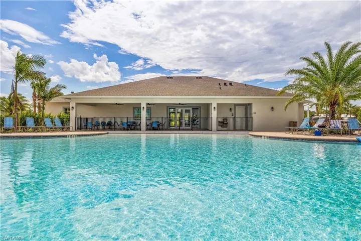 View of swimming pool featuring a patio and ceiling fan