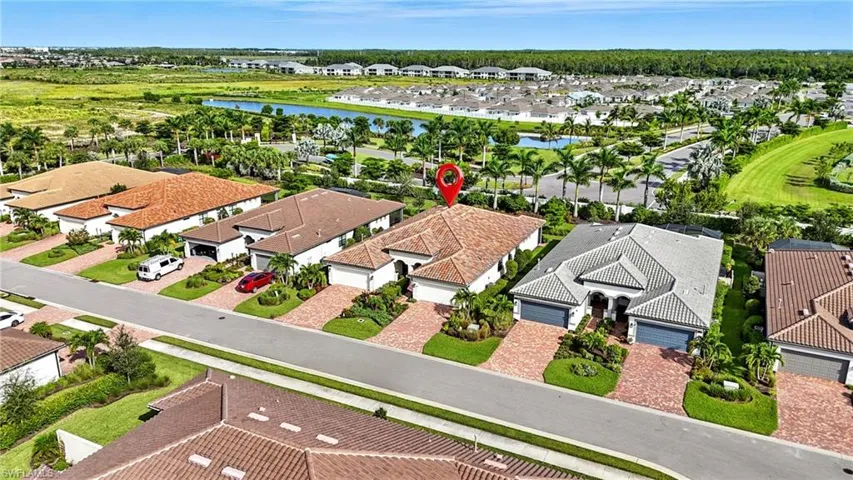 Aerial view of residential area with a nearby body of water