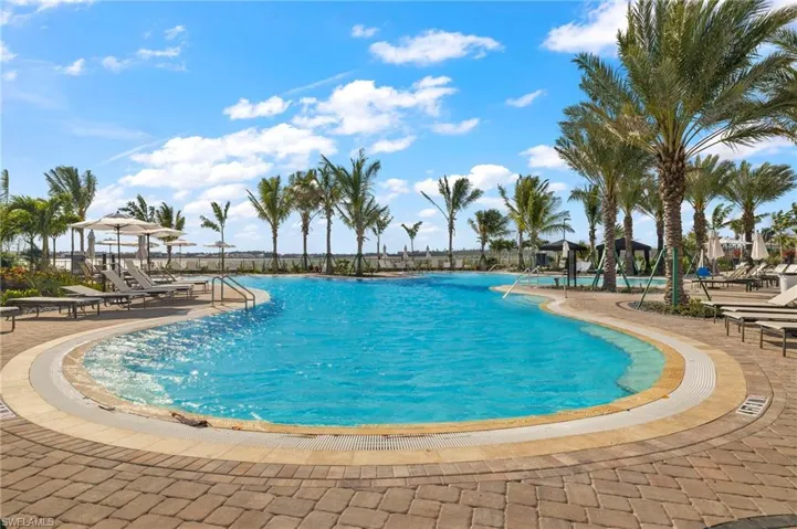 Community pool featuring a patio