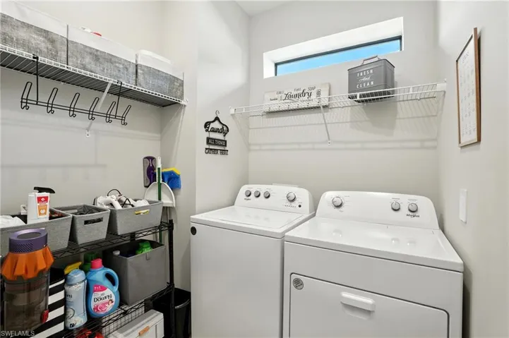 Washroom featuring separate washer and dryer