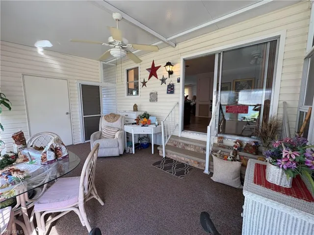 Sunroom featuring ceiling fan
