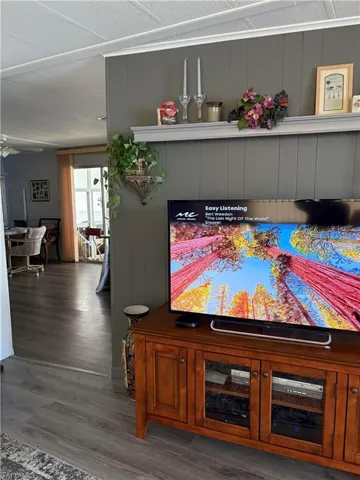Interior details with hardwood / wood-style floors and a textured ceiling