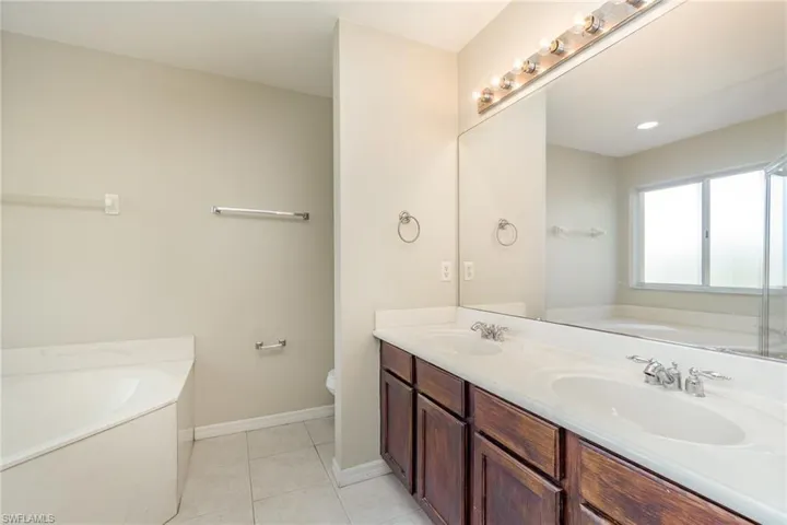 Primary bathroom with soaking tub and dual sinks