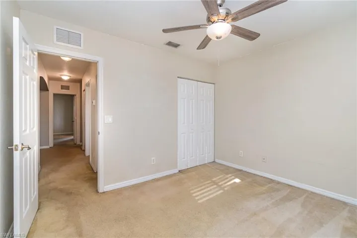 Bedroom 2 with walk in closet and fan/light