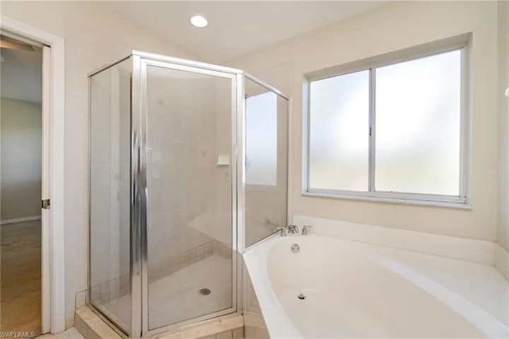 Primary bathroom with soaking tub and stand up shower