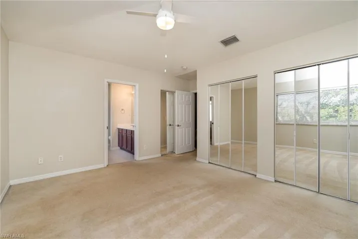 Primary bedroom with wall of closets and a Huge walkin in closet.