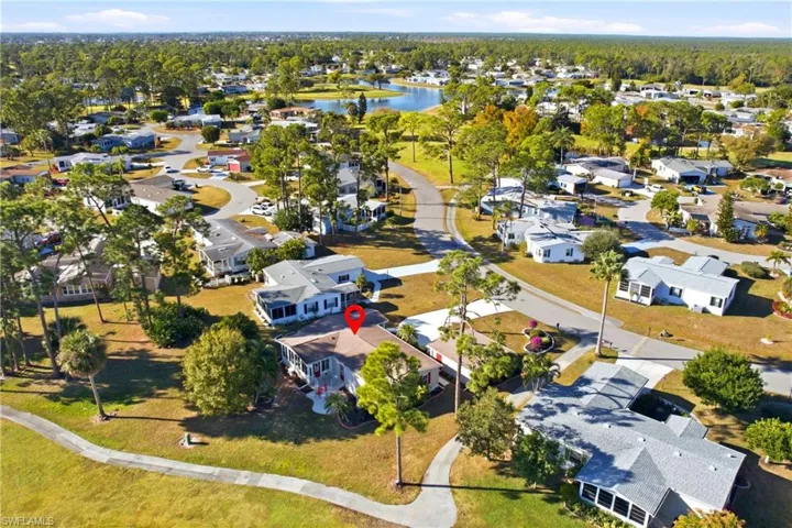 Aerial view of residential area featuring a large body of water