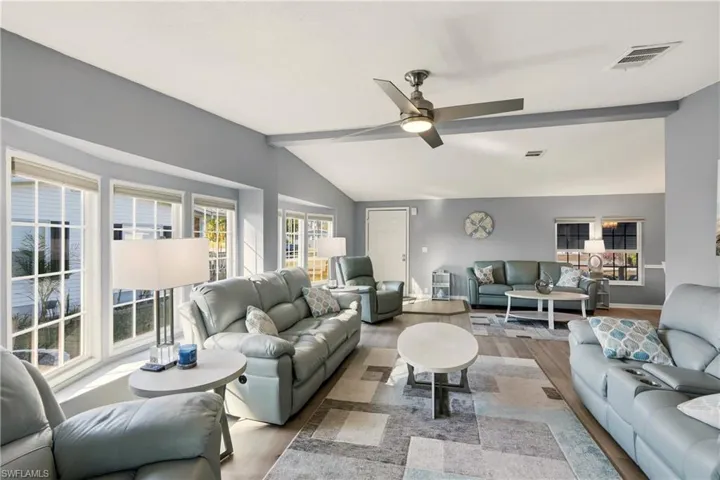 Living room featuring wood finished floors and ceiling fan
