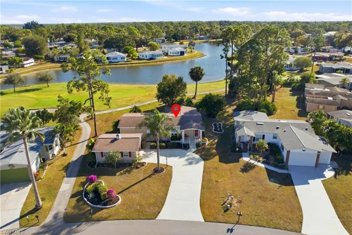 Aerial view of residential area featuring a large body of water