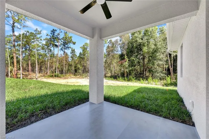 View of patio featuring ceiling fan