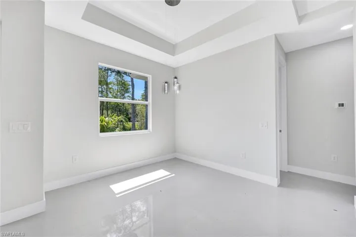 Spare room featuring concrete flooring