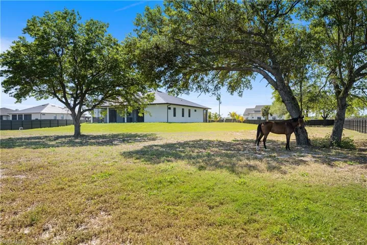 View of yard featuring fence