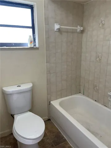 Full Bathroom with Tub Shower Combination and Hallway Vanity