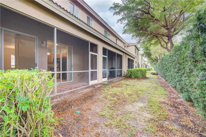 View of yard featuring a sunroom
