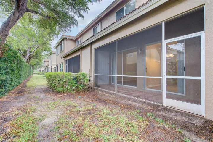 View of yard with a sunroom