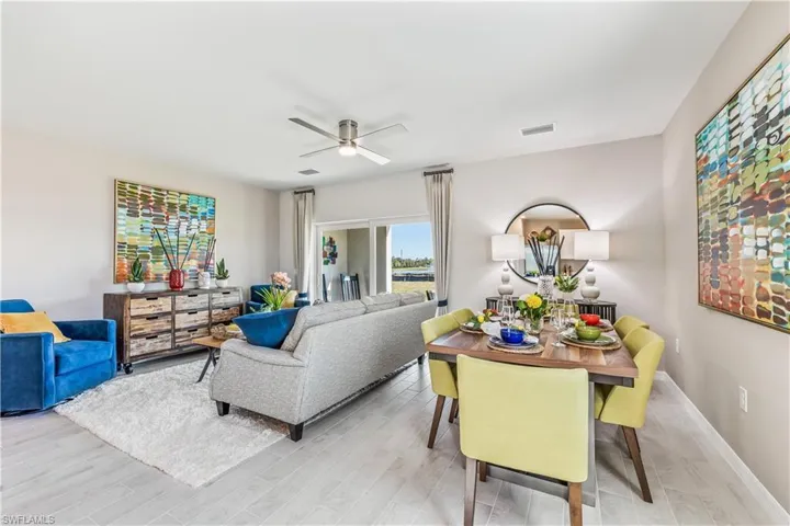 Living room featuring ceiling fan and light hardwood / wood-style floors