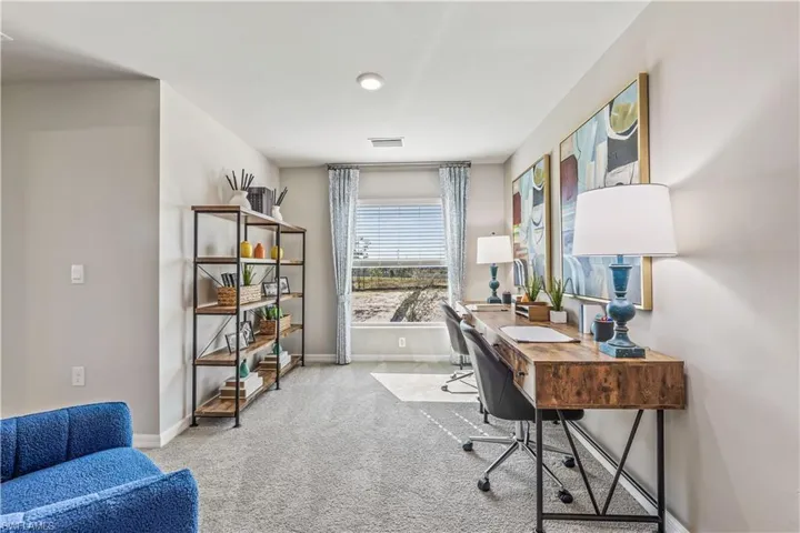 Office space featuring light colored carpet