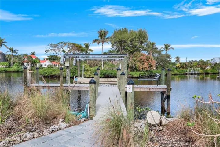 Dock area featuring a water view and 10,000lbs boat lift
