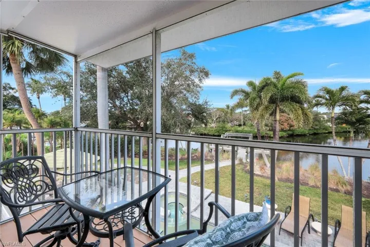 Sunroom with plenty of natural light and a water view of Imperial River