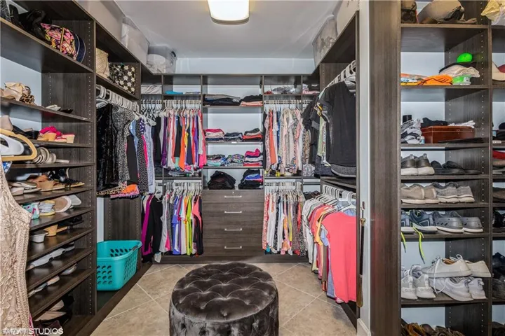 Spacious closet featuring light tile patterned floors
