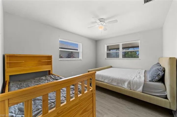 Primary bedroom with windows overlooking the canal