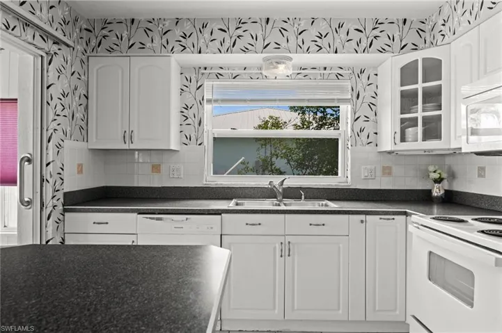Kitchen has lots of cabinets