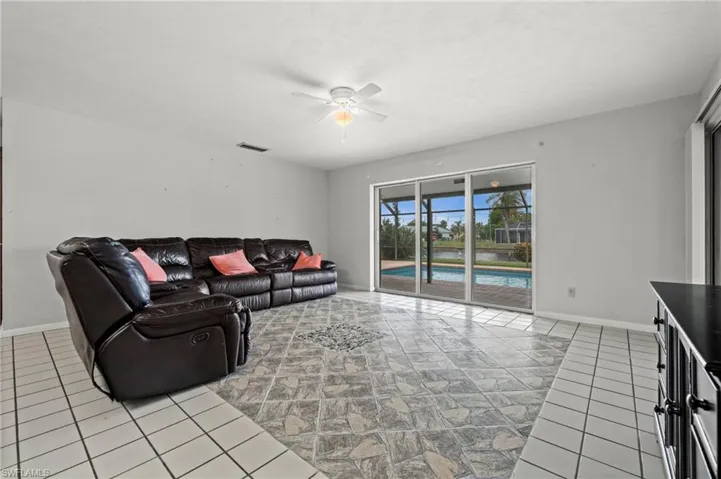 Living room also has direct access to the pool. Great SW Florida indoor-outdoor living