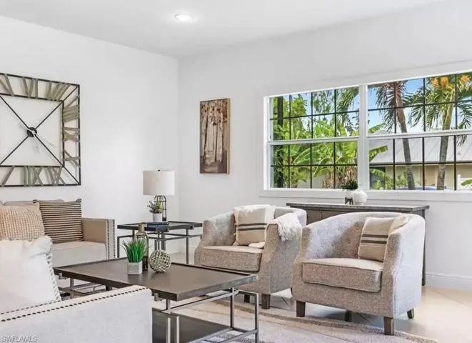 Living area featuring baseboards and recessed lighting