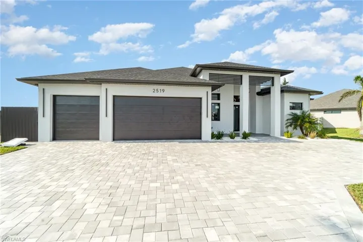 Prairie-style house featuring a garage