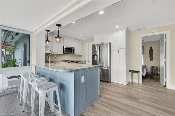 Kitchen features stainless appliances, shaker cabinets and granite countertops!