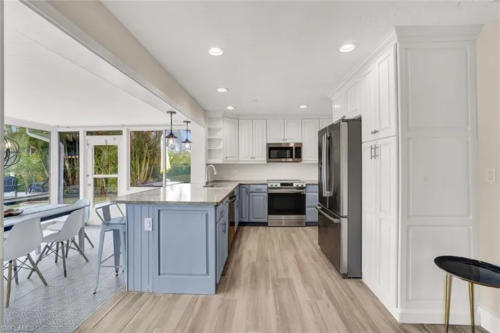 View of the kitchen and dining room from the main living area.