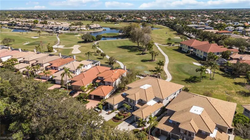 View of property location featuring a nearby body of water and nearby suburban area