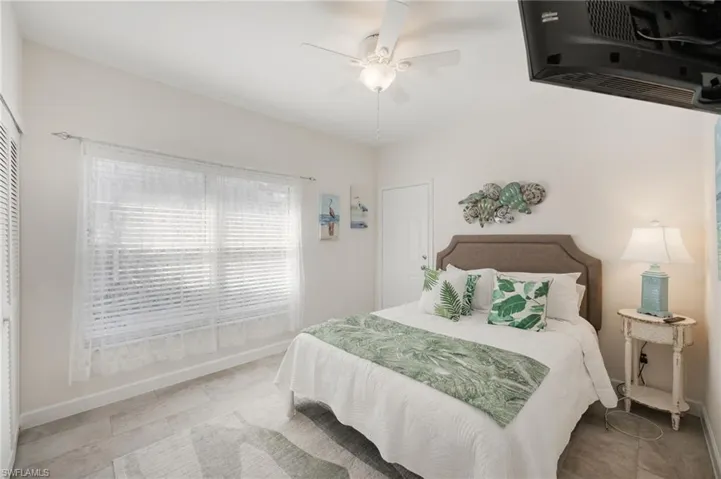 Bedroom featuring baseboards and ceiling fan