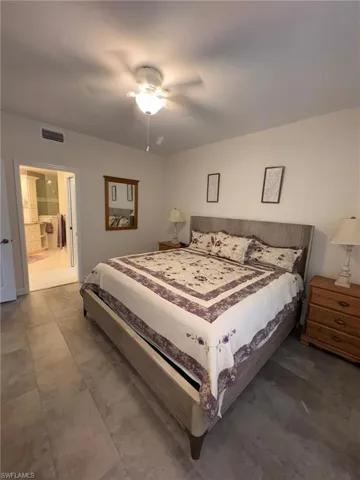 Spacious room featuring tile-style flooring, a ceiling fan, and recessed lighting