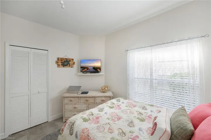 Bedroom with a closet and baseboards