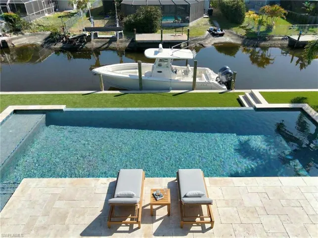 Visualize building your resort style pool near the dock for the boating days