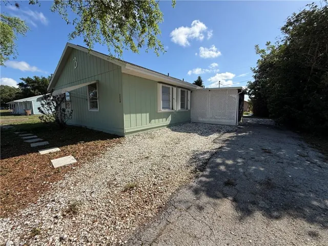 View of side of property with driveway