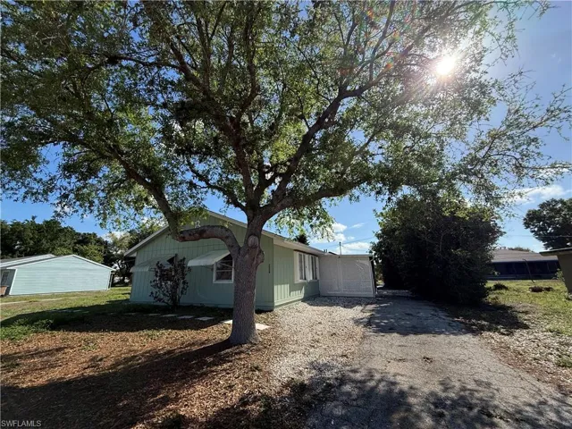 View of side of home featuring driveway