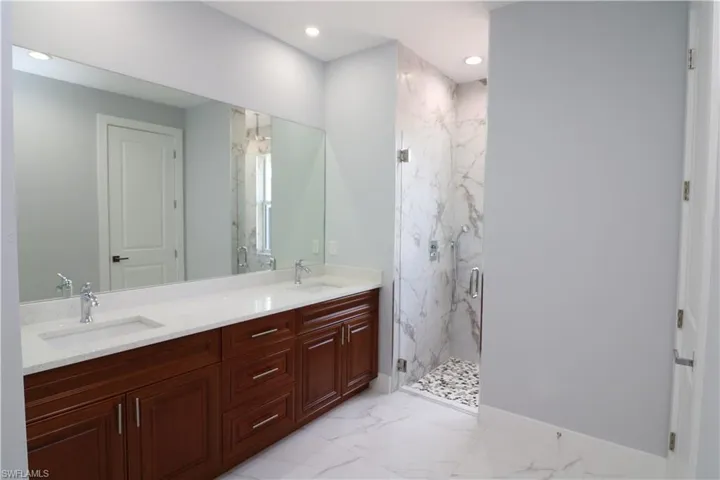 Bathroom with vanity and walk in shower