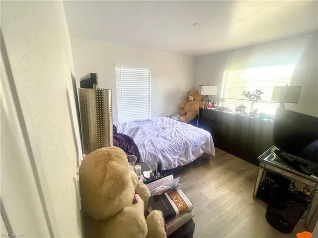 Bedroom with wood finished floors