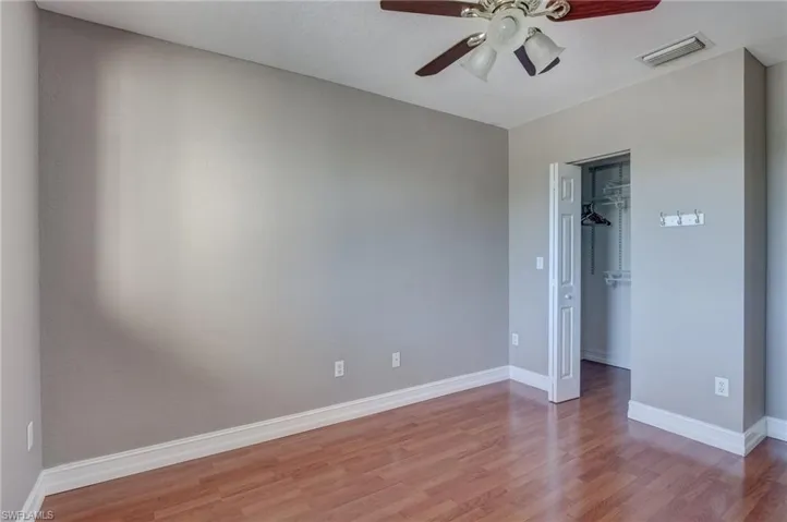 Bedroom featuring wood-type flooring and ceiling fan