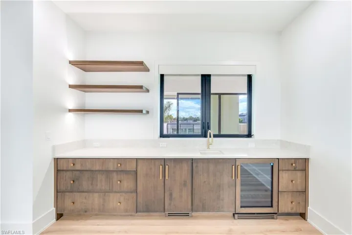 Custom Ruffino Wet bar and lighted shelves