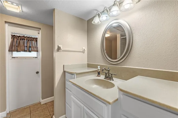 Hall bath has pool access