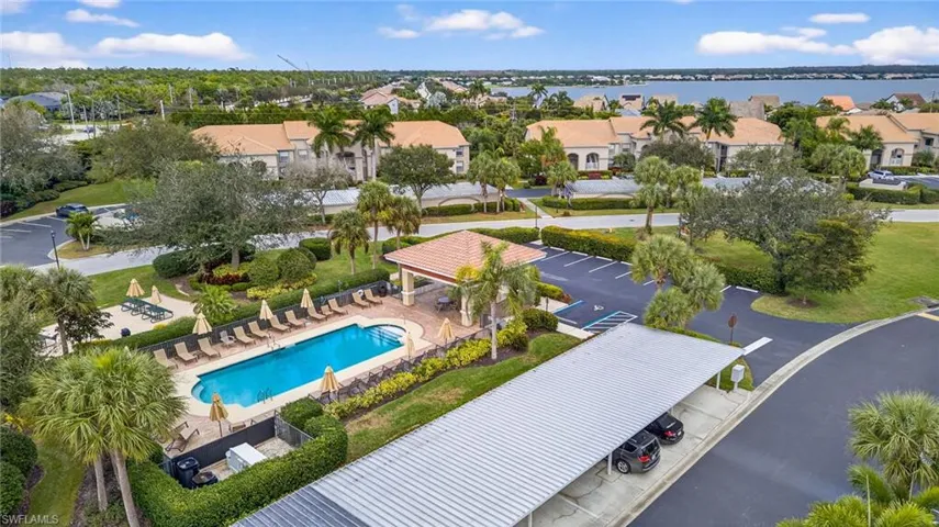 Aerial perspective of condo area featuring a pool