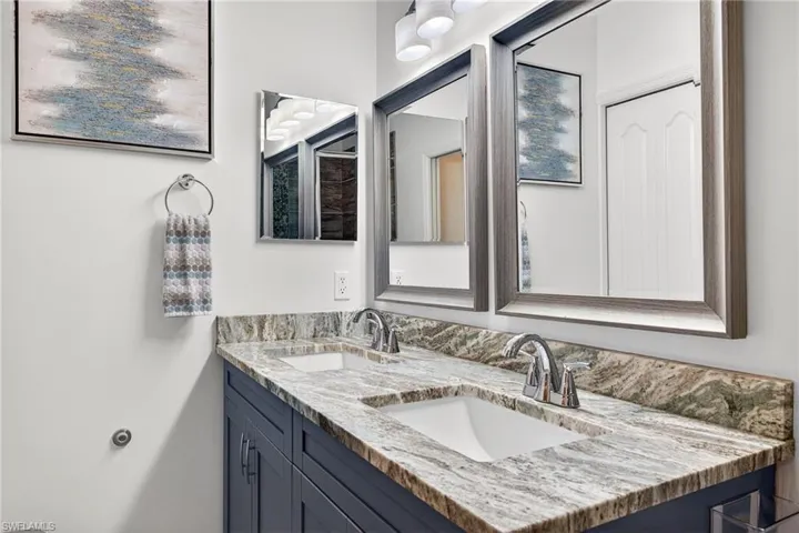 Full bathroom featuring double vanity