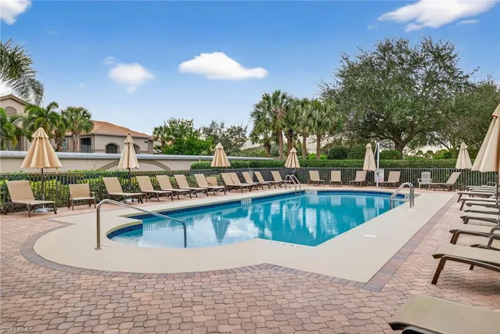 Community pool featuring a patio area